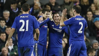 Chelsea's Oscar, second left, celebrates scoring his hat-trick goal with, from left, Nemanja Matic, Eden Hazard and Branislav Ivanovic during the English FA Cup fourth round soccer match between Milton Keynes Dons and Chelsea at Stadium mk in Milton Keynes, England, Sunday, Jan. 31, 2016. (AP Photo/Kirsty Wigglesworth)