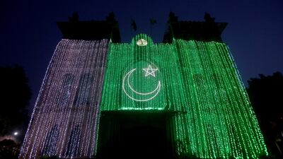 The Metropolitan building illuminated with Pakistan's national flag in Lahore, Pakistan. Reuters