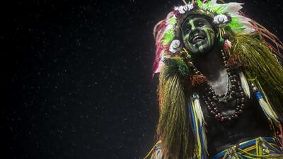 A member of Academicos do Grande Rio Samba School smiles during the 2020 Rio de Janeiro Carnival champions' parade at the Sapucai Sambadrome. Getty Images