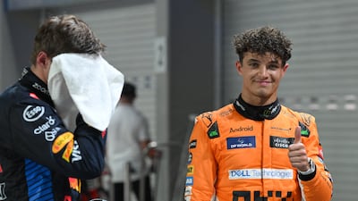 Formula One F1 - Singapore Grand Prix - Marina Bay Street Circuit, Singapore - September 21, 2024 McLaren's Lando Norris celebrates after qualifying in pole position REUTERS / Caroline Chia