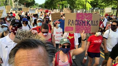 US senator Mitt Romney marches during a protest against racial inequality in the aftermath of the death in Minneapolis police custody of George Floyd, in Washington DC. Reuters