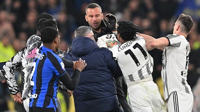 Players of Juventus and Inter argue at the end of their Coppa Italia semi-final first leg. EPA
