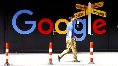 A man walks past a logo of Google in front of an office building in Zurich. Reuters