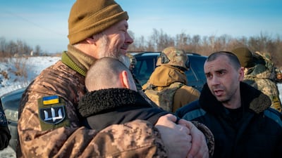 Ukrainian prisoners of war after a prisoner exchange at an undisclosed location in Ukraine on January 21, 2024. Ukrainian President Volodymyr Zelenskyy on X / AP