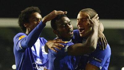 Everton's Joseph Yobo, centre, reacts after scoring his side's first goal with teammates Joao Alves Jo, left, and Jack Rodwell, right, during their match against AEK Athens.