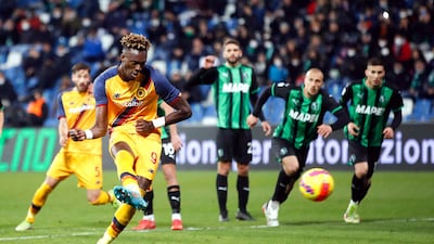 Roma sriker Tammy Abraham scores from the penalty spot against Sassuolo. EPA