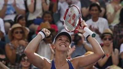 Germany's Sabine Lisicki celebrates after beating Czech Republic's Karolina Pliskova in their Hong Kong Open final on Sunday. Bobby Yip / Reuters / September 14, 2014