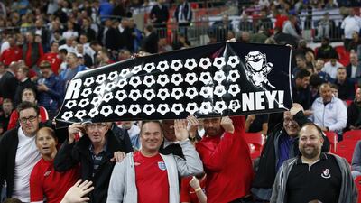 England fans show their support for Wayne Rooney on Tuesday during a Euro 2016 qualifying victory over Switzerland at Wembley. Carl Recine / Action Images / Reuters
