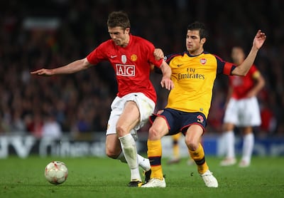 Arsenal's Cesc Fabregas challenges Michael Carrick of Manchester United during the Uefa Champions League semi final first leg in 2009. Getty Images