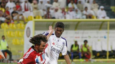 Al Ain keeper Dawoud Sulaiman dives to make a risky save in the Super Cup final. Mike Young / The National