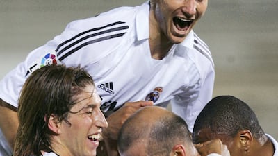 Ivan Helguera celebrates with Zinedine Zidane and Sergio Ramos after a goal during a La Liga match against Malaga in 2005. Getty