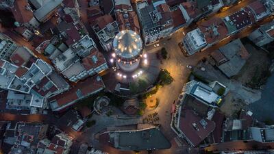 An aerial picture taken by drone shows a general view of Galata Tower and empty streets during curfew in Istanbul, Turkey. EPA