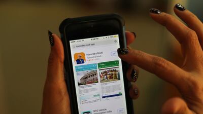 A woman about to download Indian Prime Minister Narendra Modi's official smartphone app in New Delhi on March 26, 2018. Manish Swarup / AP Photo