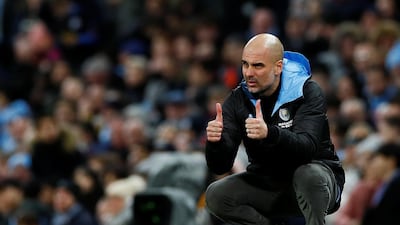 Pep Guardiola gives his players the thumbs up. Reuters