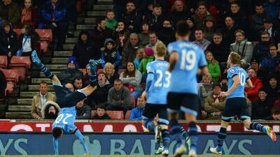 Dele Alli of Tottenham Hotspur celebrates with teammates as he scores their second goal. Gareth Copley / Getty Images