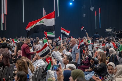 People cheer and celebrate at the Emirates Loves Iraq community event at Expo City Dubai, UAE, on Saturday. Ahmed Ramzan / The National