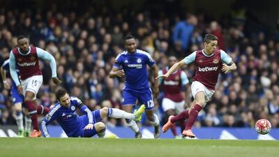 Chelsea’s Cesc Fabregas in action with West Ham’s Manuel Lanzini. Reuters / Hannah McKay