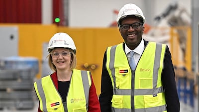 British Prime Minister Liz Truss and Chancellor of the Exchequer Kwasi Kwarteng visit Berkeley Modular in Kent, England, on Friday. AP.