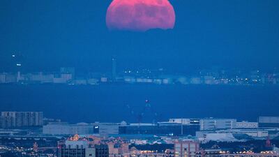 The full moon as seen from the observation deck of Roppongi Hills Mori Tower, during a harvest-moon viewing event in Tokyo, Japan. AFP