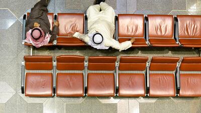 Kuwaiti traders observe the stock market at the trading hall of the Kuwait Stock Exchange, in Kuwait City. EPA