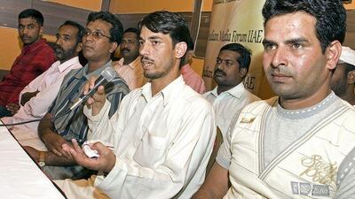 Safeer Ahmad, centre, one of the nearly 1,400 Atlantic Emirates Group employees, speaks during a press conference with his colleagues in Dubai yesterday.