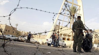 Iraqi security forces survey the scene outside the Sayidat al-Nejat Catholic Cathedral in central Baghdad.