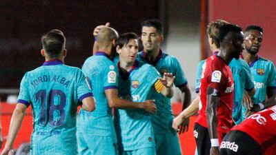 Barcelona's Lionel Messi, centre, celebrates with his teammates after scoring his side's fourth goal against Real Mallorca at Son Moix Stadium. AP Photo