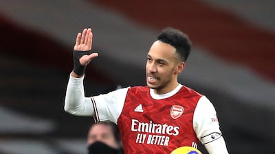 Pierre-Emerick Aubameyang of Arsenal walks off with the match ball after scoring a hat-trick. EPA