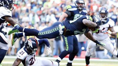 Seattle Seahawks running back Marshawn Lynch rushes for the winning touchdown against the Denver Broncos during overtime on Sunday in the NFL. Joe Nicholson / USA Today Sports / September 21, 2014