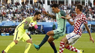 Left to right: Goalkeeper Rui Patricio and Jose Fonte of Portugal in action against Mario Mandzukic of Croatia during their Euro 2016 last-16 match at Stade Bollaert-Delelis in Lens Agglomeration, France. EPA/ROLEX DELA PENA