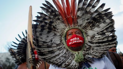 Indigenous Brazilians stage protest against their country hosting the Copa America football tournament in Brazil. Reuters