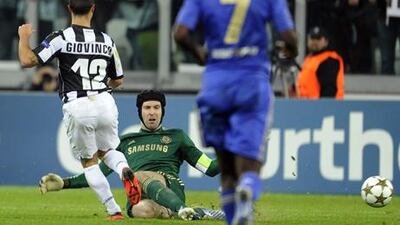 Juventus' Sebastian Giovinco knocks the ball past an outrushing Petr Cech to score the third against Chelsea.