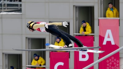 Lukas Klapfer, of Austria, soars through the air during the competition jump in the nordic combined event at the 2018 Winter Olympics in Pyeongchang. Dmitri Lovetsky / AP Photo
