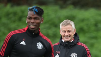 Paul Pogba and Manchester United manager Ole Gunnar Solskjaer in buoyant mood.