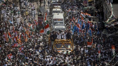 Congress Party’s Rahul Gandhi, centre, waves to supporters. Kevin Frayer/Getty Images