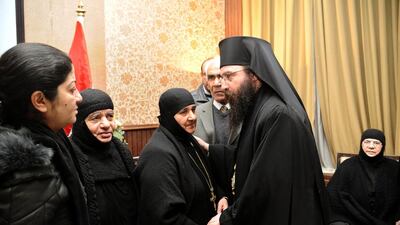 Syrian orthodox church officials meet some of the 16 nuns and their helpers freed by rebels on Monday, March 10, 2014, ending their four-month captivity. Their release is a rare successful example of a prisoner-exchange deal between Syrian government authorities and the rebels. AP Photo/ SANA