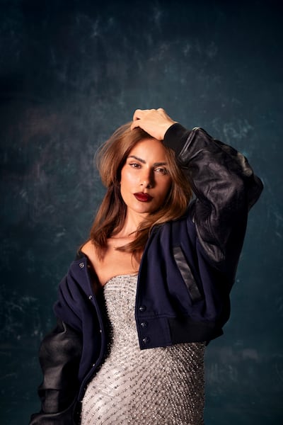 Shelly dress, Dh 36,725, Ralph Lauren Collection. Leather sleeved bomber jacket, Dh4,358, Polo Ralph Lauren