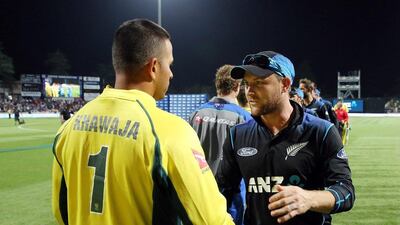Usman Khawaja of Australia (L) and Brendon McCullum of New Zealand shake hands after the third one-day international cricket match between New Zealand and Australia at Seddon Park in Hamilton on February 8, 2016. AFP PHOTO / MICHAEL BRADLEY