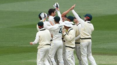 Mitchell Starc is congratulated by teammates after running out of Keshav Maharaj. Getty