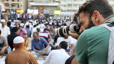The usually busy area grinds to a halt before iftar, with community members waiting for the adhan, call to prayer, as the iftar meal is served. Pawan Singh / The National