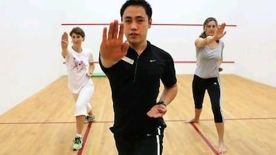 The fitness instructor, Paulo Bautista, teaches Yi Lu Quan at the Abu Dhabi Golf Club. Fatima Al Marzooqi / The National