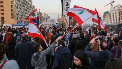 Anti-government protesters shout slogans as they hold up placards with slogans such as 'No Trust' in central Beirut. Lebanon's economy has contracted and sentiment is at an all time low. EPA