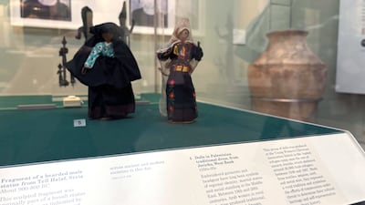A display at the British Museum labelled 'dolls in Palestinian traditional dress, from Jericho, West Bank'. Lemma Shehadi / The National
