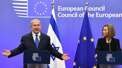 Israel's Prime Minister Benjamin Netanyahu and EU foreign policy chief, Federica Mogherini speak during a joint press conference at the European Council in Brussels on December 11, 2017. Israeli Prime Minister Benjamin Netanyahu is ?holding talks on December 11 with EU foreign ministers, days after the US decision to recognise Jerusalem as Israel's capital, a move the premier had long sought but which has been met by widespread condemnation. Emmanuel Dunand / AFP