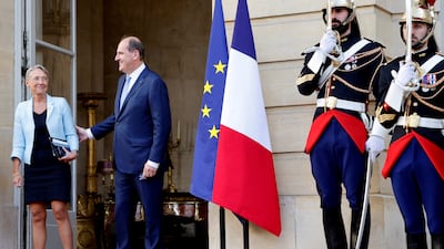 Mr Castex welcomes Ms Borne in the courtyard of the hotel. Reuters