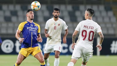 Milesi of Al Wahda and Giuliaano of Al Nassr battle for the ball. Chris Whiteoak / The National
