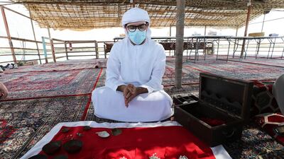 Tour guide Bilal Al Khaled shows different types of pearls at the Al Suwaidi pearl farm in Ras Al Khaimah.