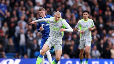Erling Haaland vies for the ball with Chelsea's Cole Palmer. Getty Images