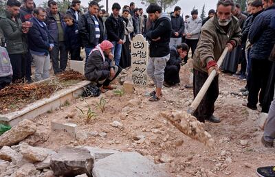 Mourners attend the funeral of Raed Fares and Hamoud Al Jneid in Kafranbel. AFP