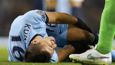 Sergio Aguero of Manchester City reacts after sustaining an injury during their English Premier League match against Everton. Reuters